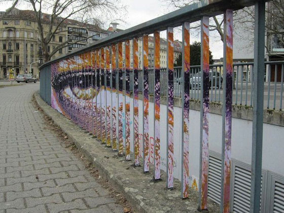 Hidden Street Art on Railings: Only Seen in Perfect Angle
