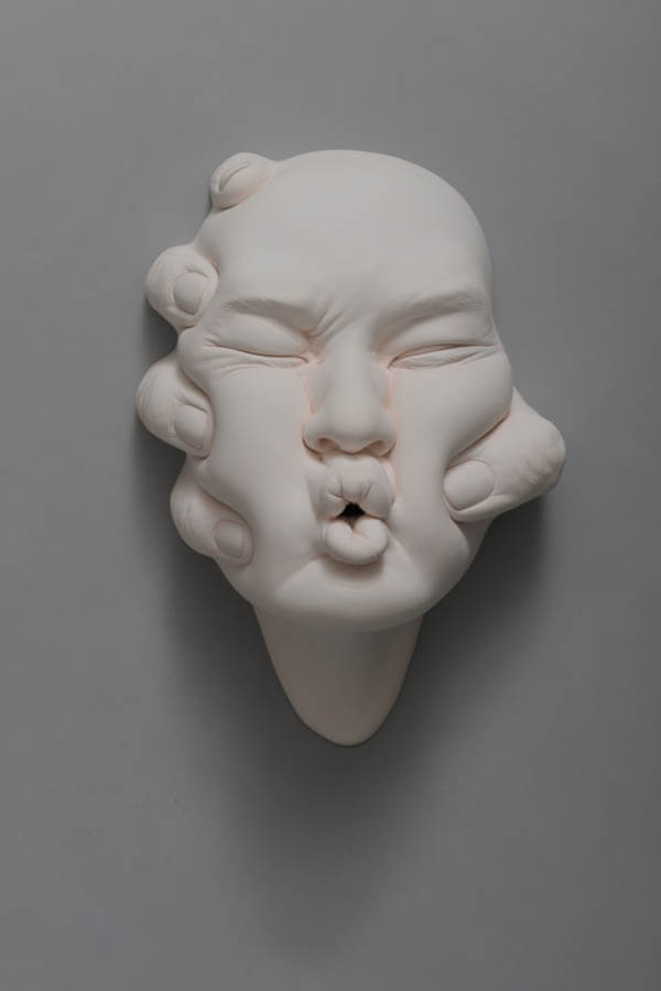 Lucid Dreams: Stunning Porcelain Sculptures of Morphing Human Faces
