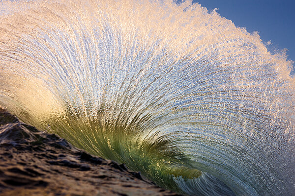 Stunning Photos of Dazzling Curvature of Waves Right as They Break