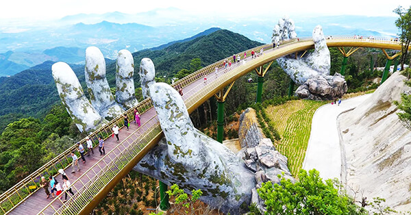 Architecture Wonder: a Pair of Giant Weathered Hands Lift Pedestrian Bridge in Vietnam