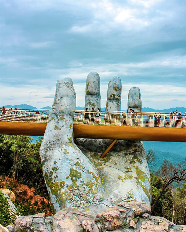 Architecture Wonder: a Pair of Giant Weathered Hands Lift Pedestrian Bridge in Vietnam
