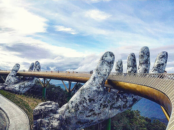 Architecture Wonder: a Pair of Giant Weathered Hands Lift Pedestrian Bridge in Vietnam