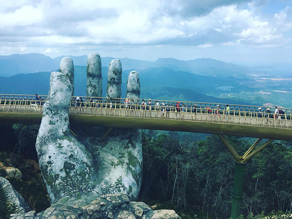 Architecture Wonder: a Pair of Giant Weathered Hands Lift Pedestrian Bridge in Vietnam