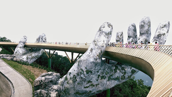 Architecture Wonder: a Pair of Giant Weathered Hands Lift Pedestrian Bridge in Vietnam