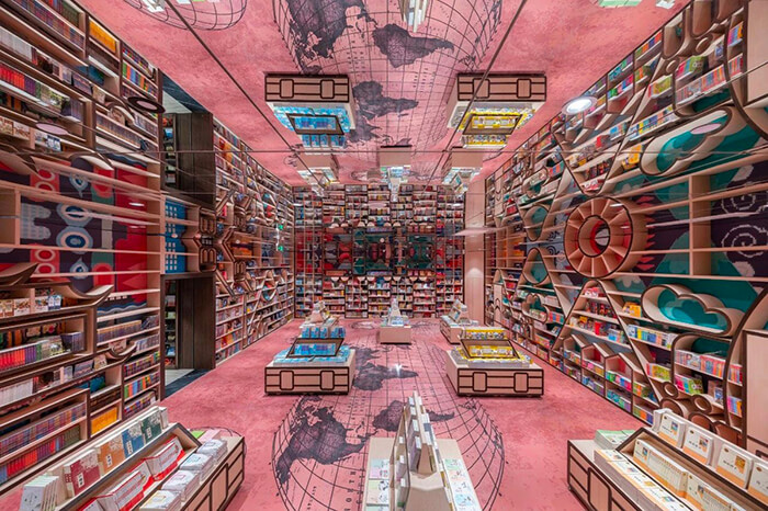 M.C. Escher Woodcut Inspired Bookstore With Mirrored Ceiling and Criss-Crossed Stairwells