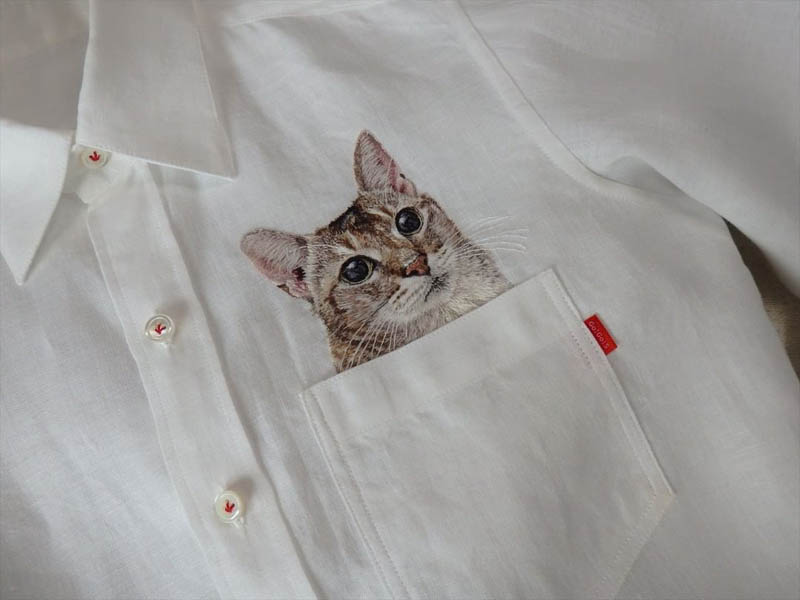 hiroko kubota embroiders cats onto shirt pockets • craft • frankie